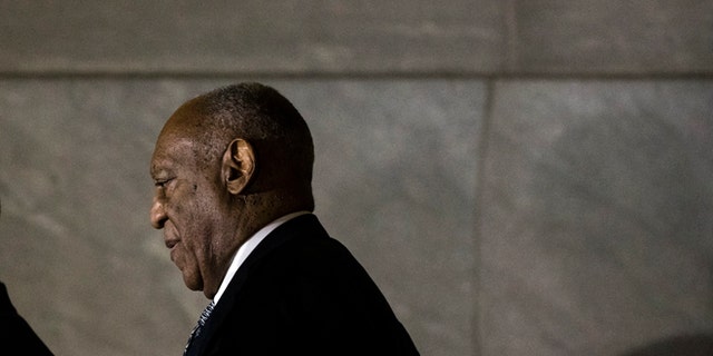 Bill Cosby walks from the Montgomery County Courthouse during his sexual assault trial.