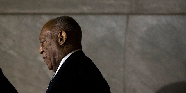 Bill Cosby walks from the Montgomery County Courthouse during his sexual assault trial.
