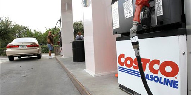 Nov. 8, 2011: Customers pump gasoline at a Costco gas station in Winter Park, Fla.