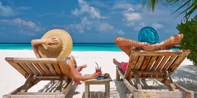 Couple on a tropical beach at Maldives