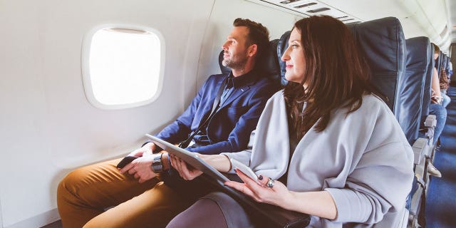 couple flying istock