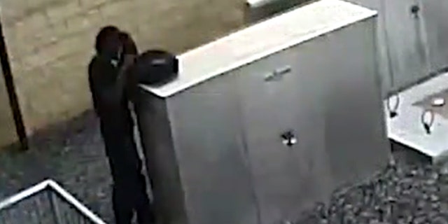 Sheldon Oliver was pictured on surveillance footage burying a gun last week outside a courthouse in Forsyth County, Georgia.