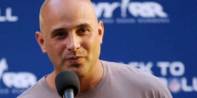 In this Aug. 30, 2012, file photo, Craig Carton talks during the National Football League Back to Football Run at Central Park in New York. Federal officials said the New York sports radio host is in custody and details of the charges against the host of WFAN-AMâs âBoomer and Cartonâ show were not immediately made public Wednesday, Sept. 6, 2017.