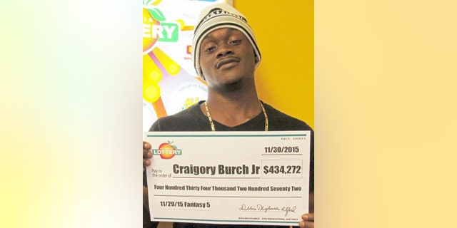Nov. 30, 2016: This photo shows Craigory Burch Jr. with his winnings from the George Lottery's Fantasy 5 game. Burch was shot and killed in an attempted robbery on Jan. 20 of this year.