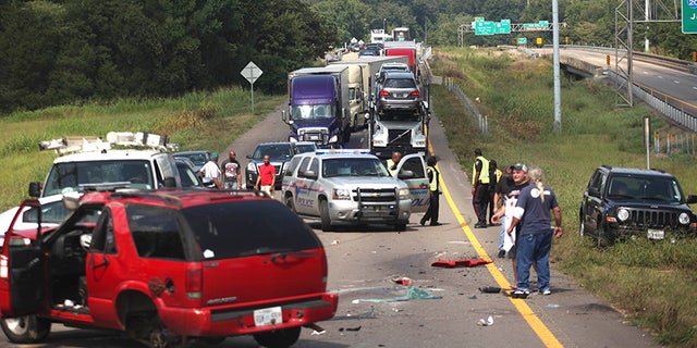 Interstate 20 West is blocked off from the Clay Street on ramp due to a three-car wreck Friday, Aug 11, 2017 in Vicksburg, Miss. Lieutenant Leonce Young with the Vicksburg Police Department said both lanes were reopened within two hours. (Courtland Wells/The Vicksburg Post via AP)