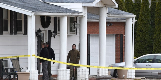 FBI and bomb squad approach a Middletown home as part of their investigation into a car that was crashed into the local hospital.