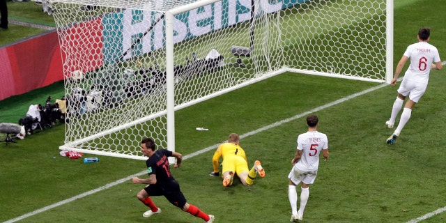 Mario Mandzukic wheels away after scoring the winning goal in Wednesday's semifinal between Croatia and England.