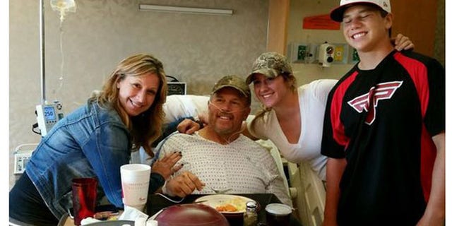 Photo shows John Sain with his wife and children after his four-day ordeal in Idaho back country with broken leg. (Jennifer Sain)
