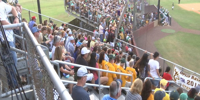 An overflow crowd fills Jim Kethan Field in Deer Park, Texas, for a playoff baseball game featuring Santa Fe High School.