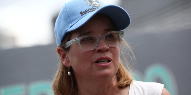 San Juan Mayor Carmen Yulin Cruz visits a market after Hurricane Maria hit the island in September, on Nov. 20, 2017.