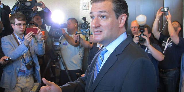Aug 30, 2014: U.S. Sen. Ted Cruz, R-Texas, speaks to reporters after his speech at the Americans for Prosperity Summit in Dallas. (AP)