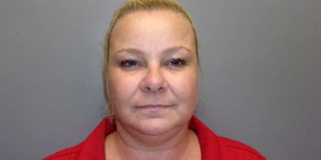 Officials said Crystelle Baton, 42, was arrested in a sting for trying to pocket a winning lottery ticket worth $600 from an unsuspecting customer who turned out to be an undercover agent.