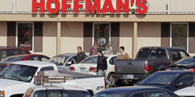 April 2, 2013: Cars jam the parking lot as shoppers leave Hoffman's Gun Center with their purchases in Newington, Conn.