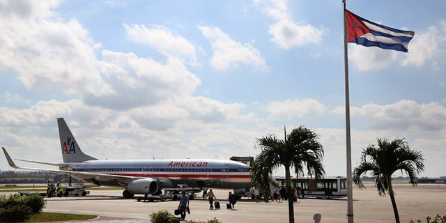 HAVANA, CUBA - JANUARY 19:  Passengers walk across the tarmac at Jose Marti International Airport after arriving on a charter plane operated by American Airlines January 19, 2015 in Havana, Cuba. Officials from the Cuban and United States governments will hold meetings this week in Havana to being establishing migration agreements and noramalized relations.  (Photo by Chip Somodevilla/Getty Images)