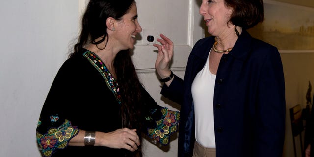 Assistant Secretary of State of the Bureau of Western Hemisphere Affairs Roberta S. Jacobson, right, talks with blogger and dissident Yoani Sanchez in Havana, Cuba, Friday, Jan. 23, 2015. (AP Photo/Desmond Boylan, Pool)