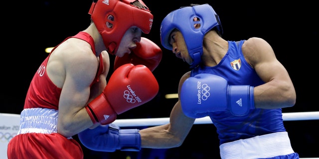 Aug. 10, 2012: Ireland's Michael Conlan, left, fights Cuba's Robeisy Ramirez Carrazana in a flyweight 52-kg semifinal boxing match at the 2012 Summer Olympics, Friday, in London.