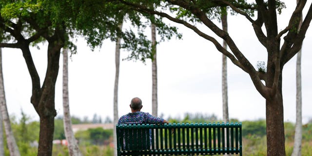 A Cuban-born businessman who spoke on the condition of anonymity for fear of deportation poses for a photo in Doral, Florida.