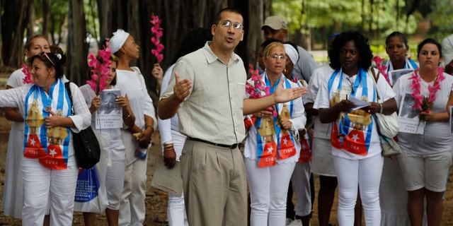 Cuban dissident Antonio Rodiles speaks during a gathering of Cuba's dissident group Ladies in White in Havana, Cuba, Sunday Dec. 28, 2014. Cubaâs government has long narrowly defined the bounds of acceptable speech, accusing many dissidents of being as agents of the U.S. government or right-wing exile groups, and subjecting them to surveillance, temporary detention and harassment. Advocates of a softer line usually receive less harsh treatment. (AP Photo/Desmond Boylan)