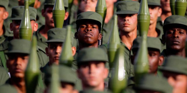 Cuban soldiers carry rocket propelled grenade launchers during a military parade in Havana's Revolution Square in 2011 file photo.