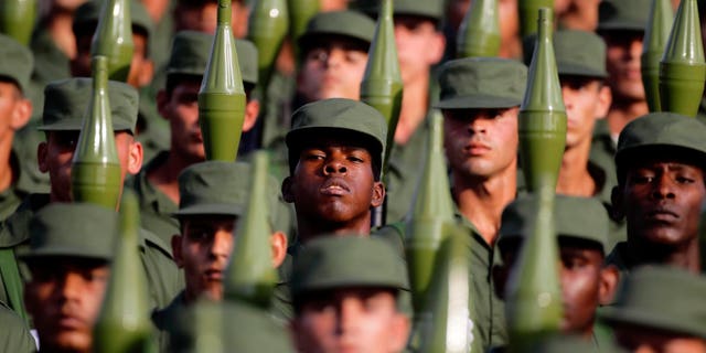 Cuban soldiers carry rocket propelled grenade launchers during a military parade in Havana's Revolution Square in 2011 file photo.