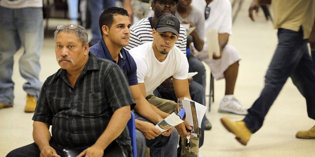 MIAMI, FL - JULY 07: Job seekers are seated as they wait for an opportunity to apply for a job during the Miami Worldcenter construction job fair on July 7, 2015 in Miami, Florida. Miami Worldcenter is a real estate development projected that is expected to be built on 27 acres of vacant land in the center of Downtown Miami's urban core and during phase one of the project, estimates to yield approximately 18,000 direct jobs and $1 billion in new economic impact, according to a study released by Miami Worldcenter. (Photo by Joe Raedle/Getty Images)