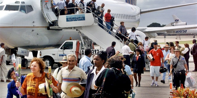 FILE:The first passengers of the first chartered flight of Continental Airlines from Miami Florida, arrives at the Jose Marti Airport of Havana, Cuba.