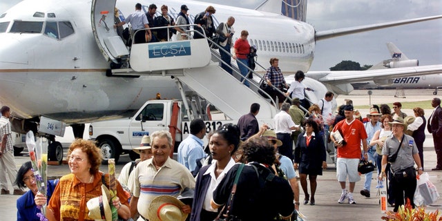 FILE:The first passengers of the first chartered flight of Continental Airlines from Miami Florida, arrives at the Jose Marti Airport of Havana, Cuba.