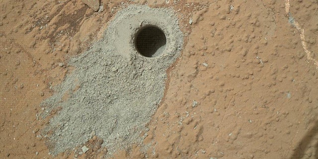 May 19, 2013: NASA's Mars rover Curiosity drilled into this rock target, "Cumberland," during the 279th Martian day, or sol, of the rover's work on Mars and collected a powdered sample of material from the rock's interior.