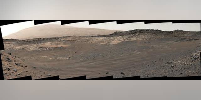 This image, captured by NASA’s Mars rover Curiosity on May 10, 2015, shows rough terrain on the way to an outcrop (light-colored rock in middle distance). Curiosity’s handlers decided not to traverse this terrain and took a different route inst