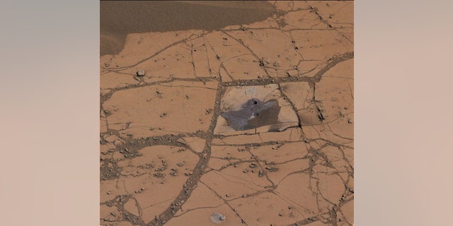 The first holes drilled by NASA's Mars rover Curiosity revealed significant amounts of hematite, an iron-oxide mineral.
