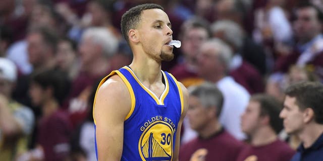 Jun 8, 2016; Cleveland, OH, USA; Golden State Warriors guard Stephen Curry (30) reacts while walking to the bench during the second quarter in game three of the NBA Finals against the Cleveland Cavaliers at Quicken Loans Arena. Mandatory Credit: Ken Blaze-USA TODAY Sports