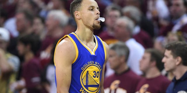 Jun 8, 2016; Cleveland, OH, USA; Golden State Warriors guard Stephen Curry (30) reacts while walking to the bench during the second quarter in game three of the NBA Finals against the Cleveland Cavaliers at Quicken Loans Arena. Mandatory Credit: Ken Blaze-USA TODAY Sports