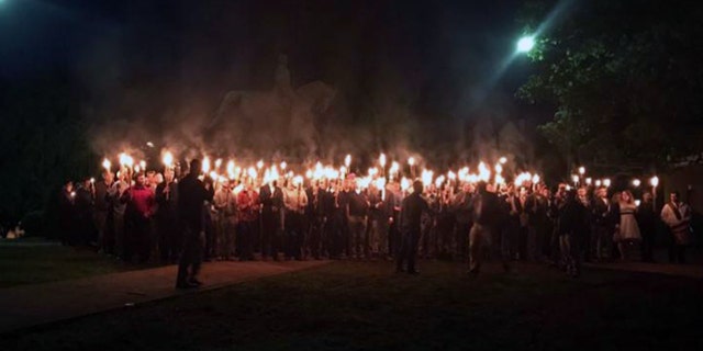 Protesters rally against the planned removal of a statue of Robert E. Lee in Charlottesville, Va. Saturday, May 13, 2017.