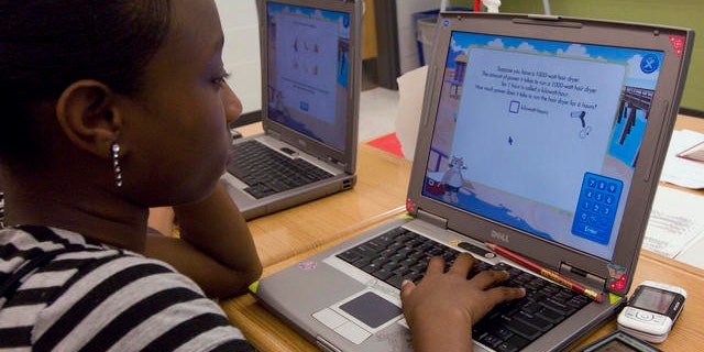 Destinee Brown, 14, and eighth grade student, works on her computer during math class at the Long Branch Middle School, a school in restructuring in the working-class New Jersey shore town of Long Branch, N.J., Friday, June 1, 2007. (Colin Archer/AP Photo)