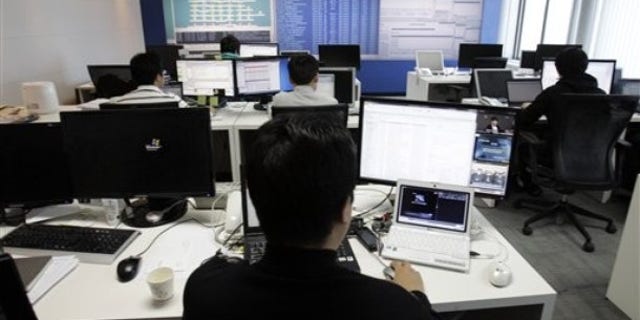 Technicians of AhnLab Inc. work against cyberattacks at the company's Security Operation Center in Seoul, South Korea