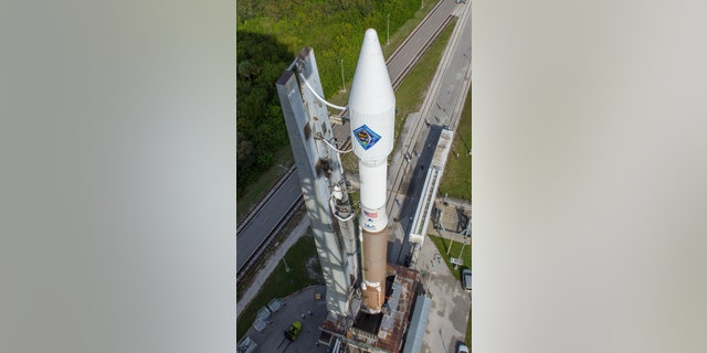 In this photo provided by the United Launch Alliance, an Atlas V rocket carrying the Orbital ATK Cygnus spacecraft, is rolled from the Vertical Integration Facility to a launch pad at the Cape Canaveral Air Force Station in Cape Canaveral, Fla., on Wednesday, Dec. 2, 2015. (United Launch Alliance via AP)