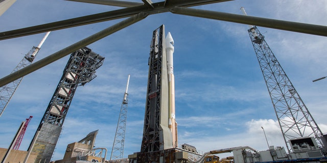 In this photo provided by the United Launch Alliance, an Atlas V rocket carrying the Orbital ATK Cygnus spacecraft, is rolled from the Vertical Integration Facility to a launch pad at the Cape Canaveral Air Force Station in Cape Canaveral, Fla., on Wednesday, Dec. 2, 2015. (United Launch Alliance via AP)