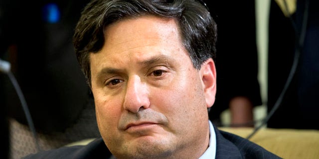 Oct. 22, 2014: Ebola coordinator Ron Klain listens as President Barack Obama speaks to the media about the government's Ebola response, in the Oval Office of the White House in Washington. (AP)