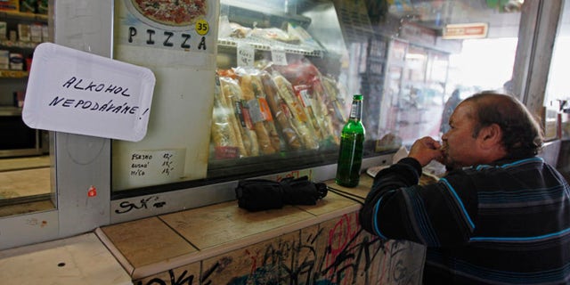 September 13, 2012: A man drinks a beer in Prague, where critics say it's cheaper to buy a brew than a cup of water.