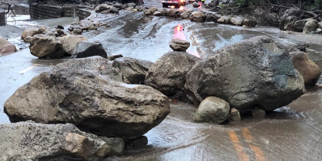Boulders block a road after a mudslide in Montecito, California, U.S. in this photo provided by the Santa Barbara County Fire Department, January 9, 2018.