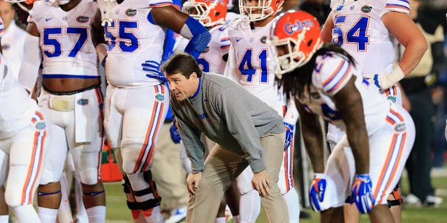 Florida coach Will Muschamp watches his players warm up for an NCAA college football game against Vanderbilt on Saturday, Nov. 8, 2014, in Nashville, Tenn. (AP Photo/Mark Humphrey)