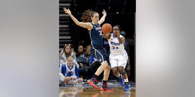 Memphis guard Devin Mack (34) passes around Connecticut forward Breanna Stewart (30) in the second half of an NCAA college basketball game Saturday, Jan. 4, 2014, in Memphis, Tenn. (AP Photo/Mark Humphrey)