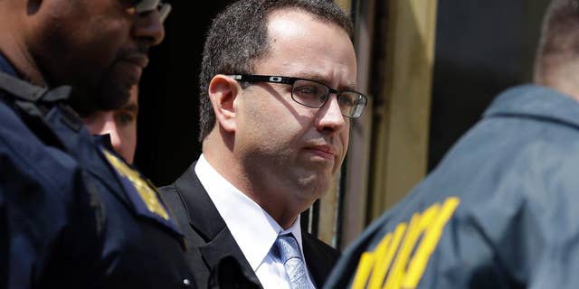 Former Subway pitchman Jared Fogle leaves the Federal Courthouse in Indianapolis, Wednesday, Aug. 19, 2015 following a hearing on child-pornography charges. Fogle agreed to plead guilty to allegations that he paid for sex acts with minors and received child pornography in a case that destroyed his career at the sandwich-shop chain and could send him to prison for more than a decade. (AP Photo/Michael Conroy)