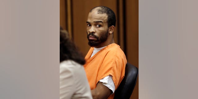 FILE - In his Aug. 20, 2013, file photo, Michael Madison looks toward the prosecuting attorney during a pretrial hearing in Cleveland. Cuyahoga County Prosecutor Timothy McGinty announced Tuesday, Oct. 29, 2013, that a grand jury added specifications that could lead to a death sentence for 35-year-old Madison, accused of killing three women whose bodies were found wrapped in plastic in East Cleveland, Ohio. (AP Photo/Tony Dejak, File)