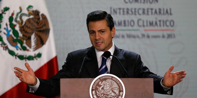 Mexico's President Enrique Pena Nieto delivers a speech during the announcement of the National System for Climate Change at the Los Pinos presidential residence in Mexico City,Tuesday, Jan. 29, 2013. (AP Photo/Dario Lopez-Mills)