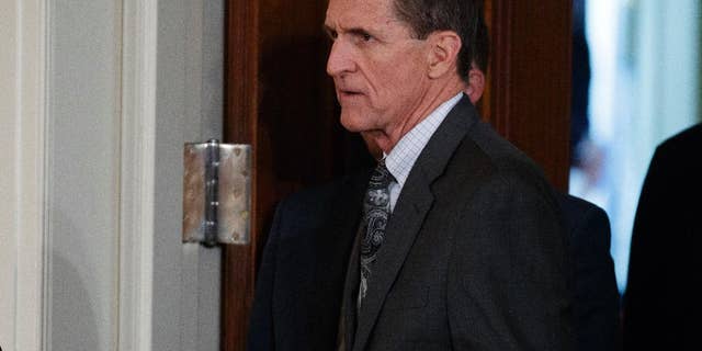 FILE - In this Feb. 13, 2017 file photo, Mike Flynn arrives for a news conference in the East Room of the White House in Washington. Targeted in widening investigations of his foreign entanglements, President Donald Trump’s former national security adviser, Michael Flynn, is at odds with his former Turkish client over two unusual payments totaling $80,000 that Flynn’s firm sent back last year to the client. The disagreement points to inconsistencies in Flynn’s accounts to the U.S. government about his work for foreign interests.(AP Photo/Evan Vucci, File)