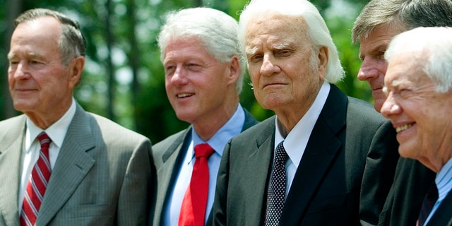 The late Rev. Billy Graham gathers with presidents George H.W. Bush, Bill Clinton and Jimmy Carter.