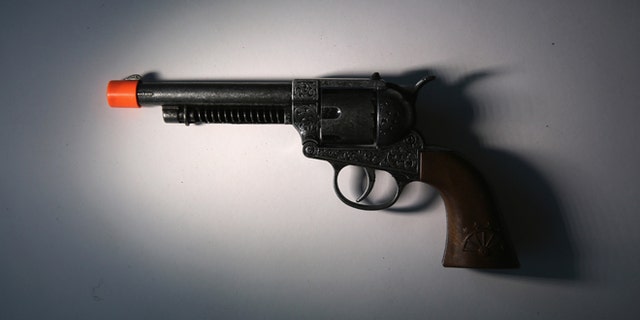 NEW YORK, NY - NOVEMBER 18: A toy gun is displayed after being confiscated at an airport security checkpoint at the JFK International Airport on November 18, 2014 in New York City. The Transportation Security Administration (TSA), displayed a cash of weapons and prohibited items taken up from travelers at airport security checkpoints and from checked luggage. The federal agency is reminding people to pack carefully during the heavy holiday travel season. (Photo by John Moore/Getty Images)