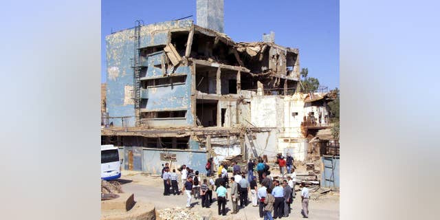 Journalists are shown Iraq's Osirak nuclear reactor in the town of al-Toweitheh, on September 9, 2002