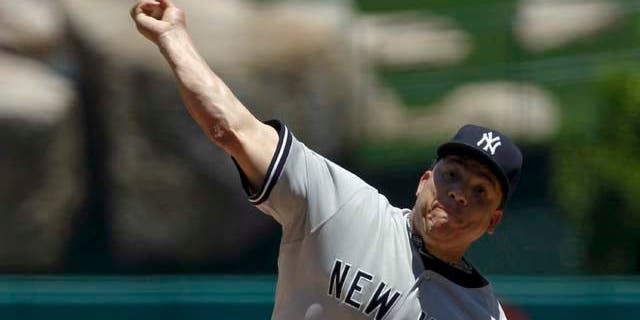 New York Yankees starting pitcher Bartolo Colon throws against the Los Angeles Angels during the first inning of a baseball game, Sunday, June 5, 2011, in Anaheim, Calif. (AP Photo/Chris Carlson)
